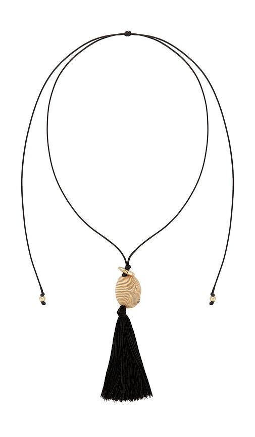 8 other reasons bold shell pendant and long tassel accent statement necklace in black.