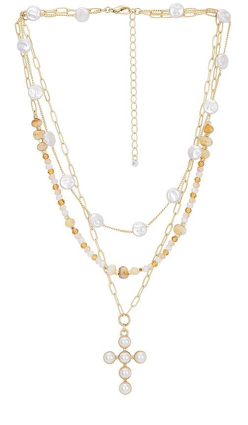 8 other reasons cross layered necklace in metallic gold.