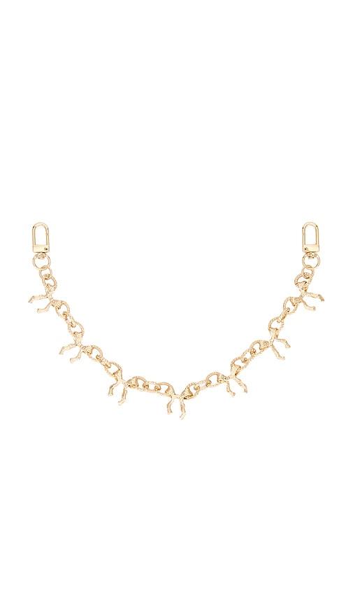 8 other reasons tatum bag charms in metallic gold.