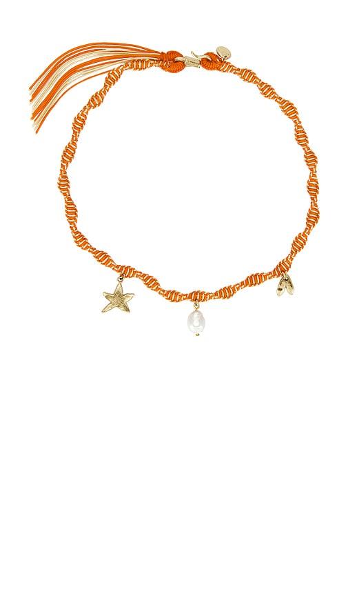 alemais calypso macrame charm necklace in orange.