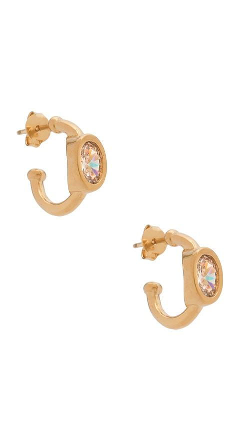 alexa leigh bezel oval hoop earrings in metallic gold.
