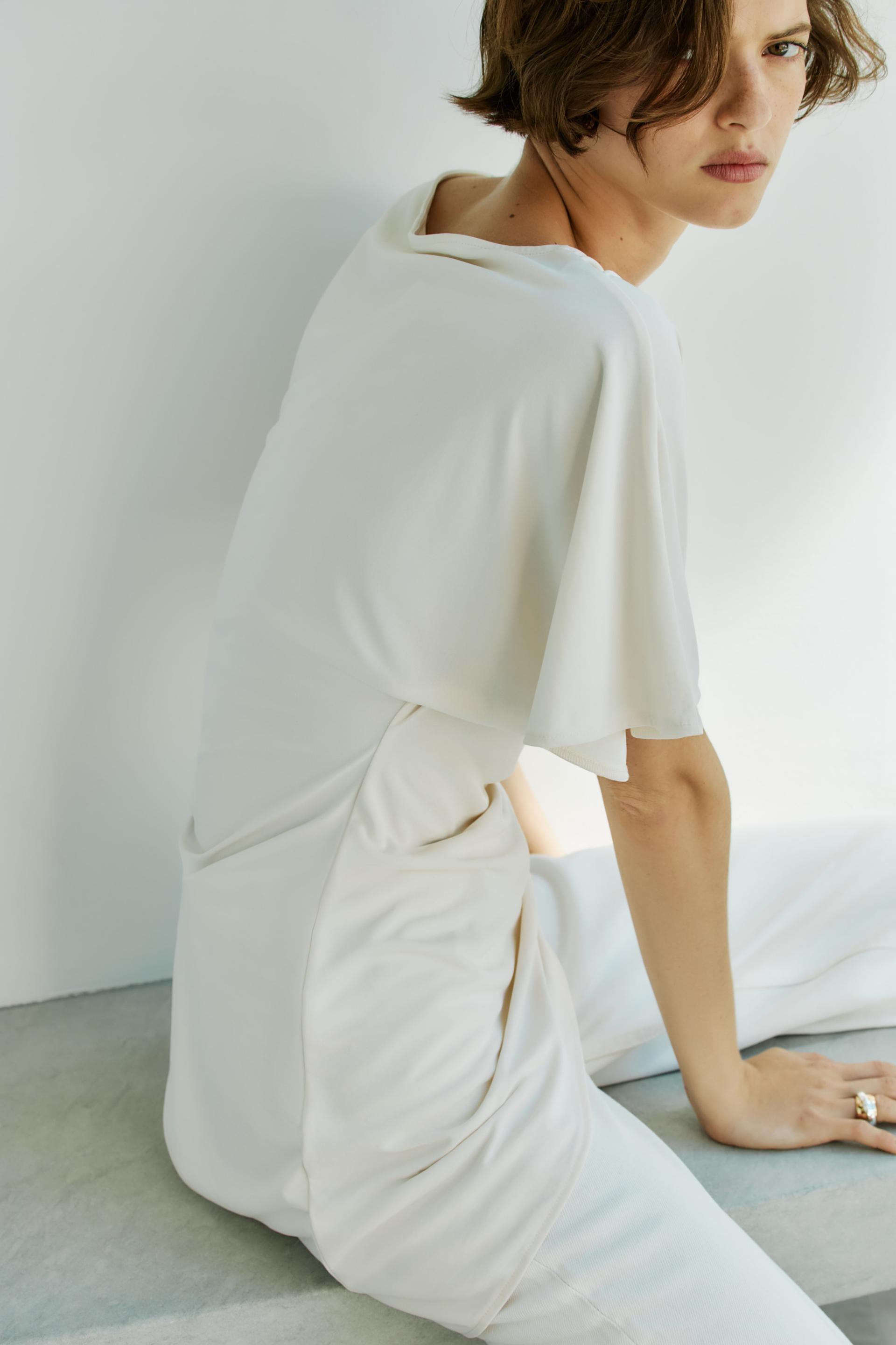asymmetric butterfly-sleeved top