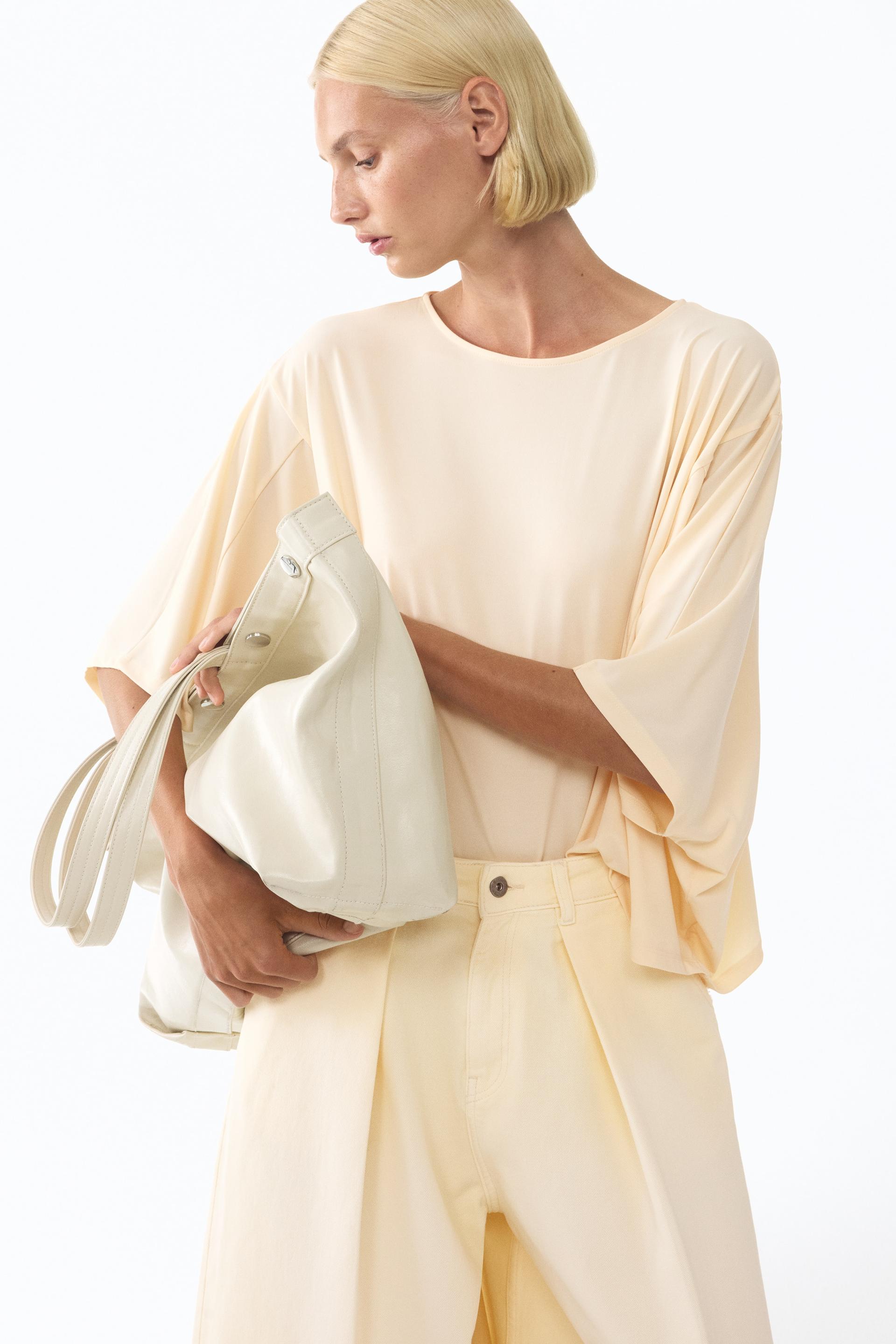batwing-sleeved top
