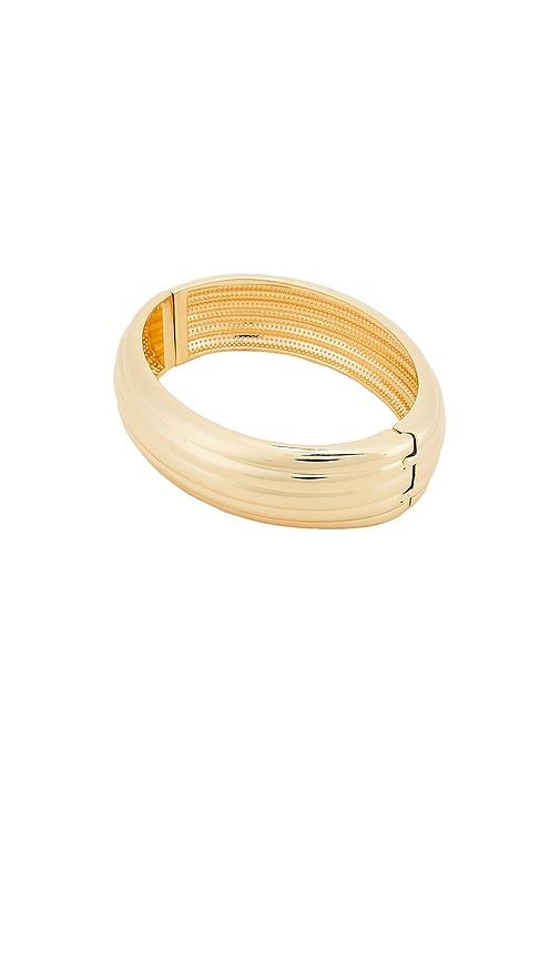 baublebar odessa hinge bangle in metallic gold.