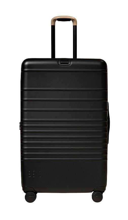 beis the large check-in roller in black.