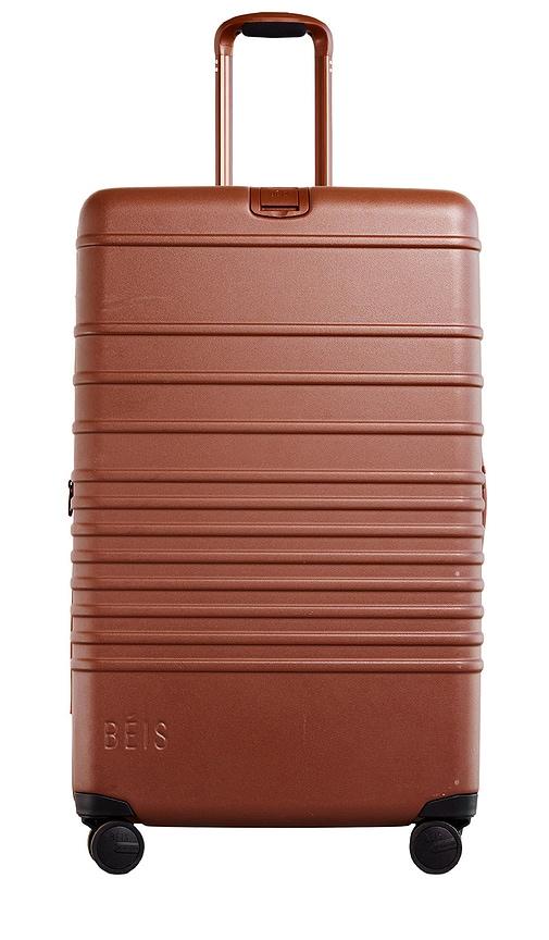 beis the large check-in roller in brown.