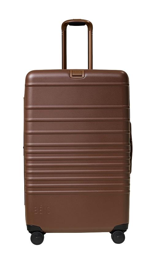 beis the large check-in roller in brown.