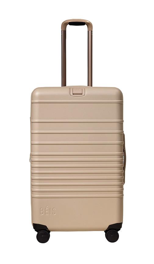 beis the medium check-in roller in beige.