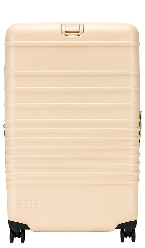 beis the medium check-in roller in beige.