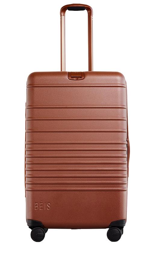 beis the medium check-in roller in brown.
