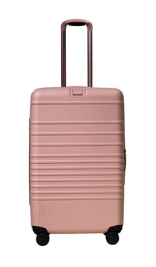 beis the medium check-in roller in pink.