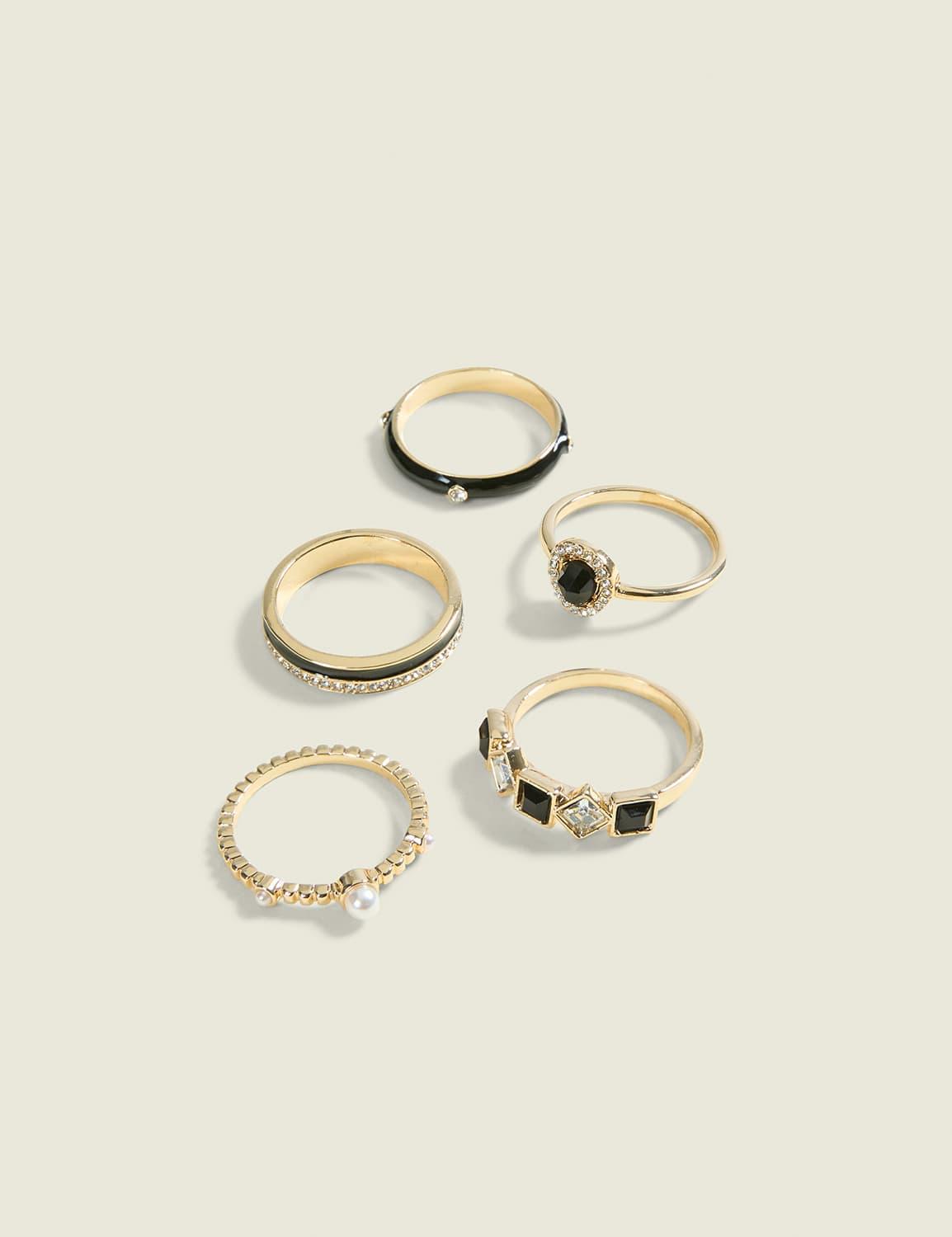 black & goldtone ring stack
