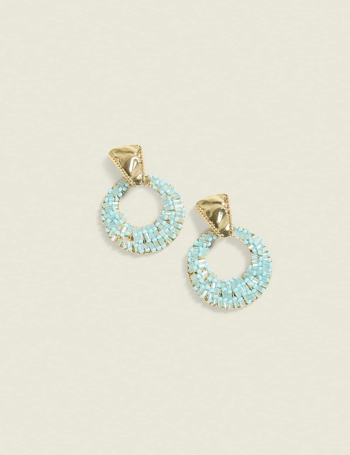 blue beaded circle statement earrings