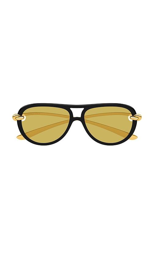 bottega veneta oval sunglasses in yellow.