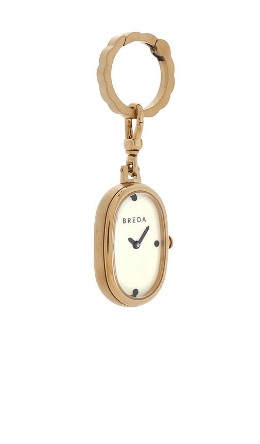 breda jane time charm watch in metallic gold.