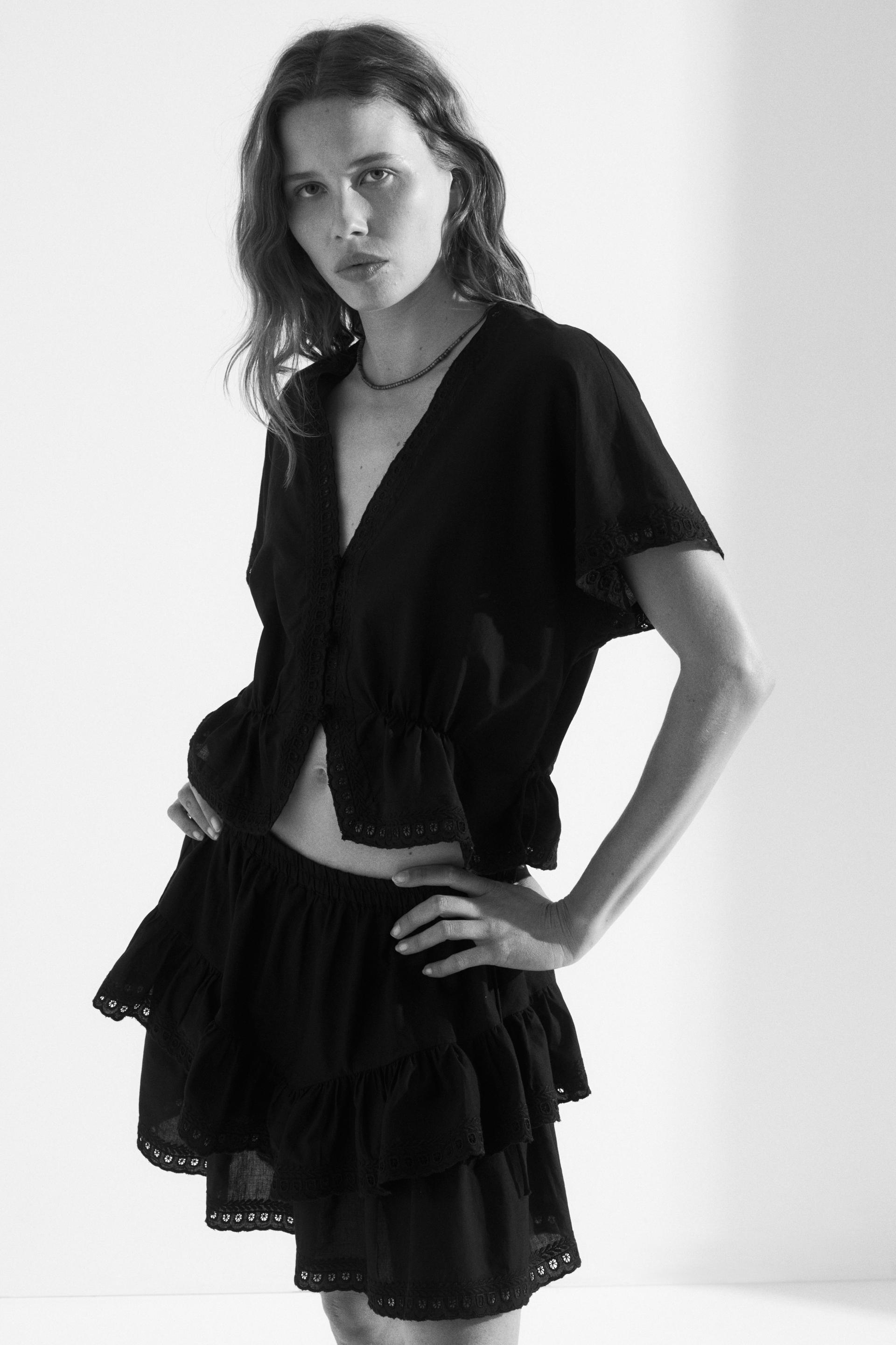 button-front top with eyelet embroidery