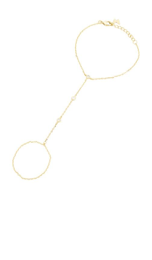 by adina eden dainty cz bezel hand chain in metallic gold.