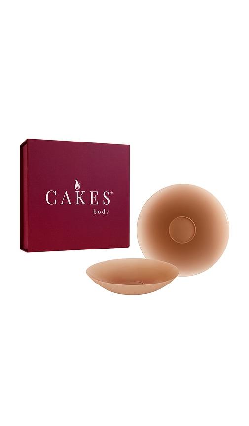 cakes body sticky circles in tan.