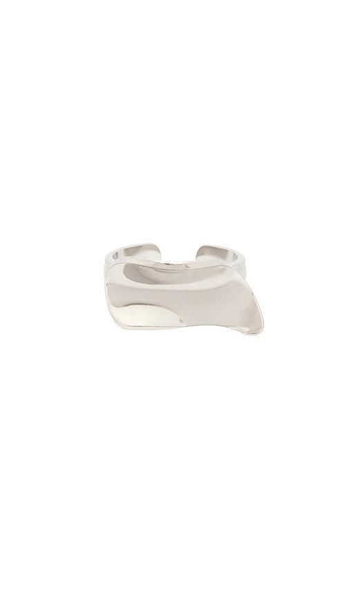 casa clara anya assymetric ring in metallic silver.