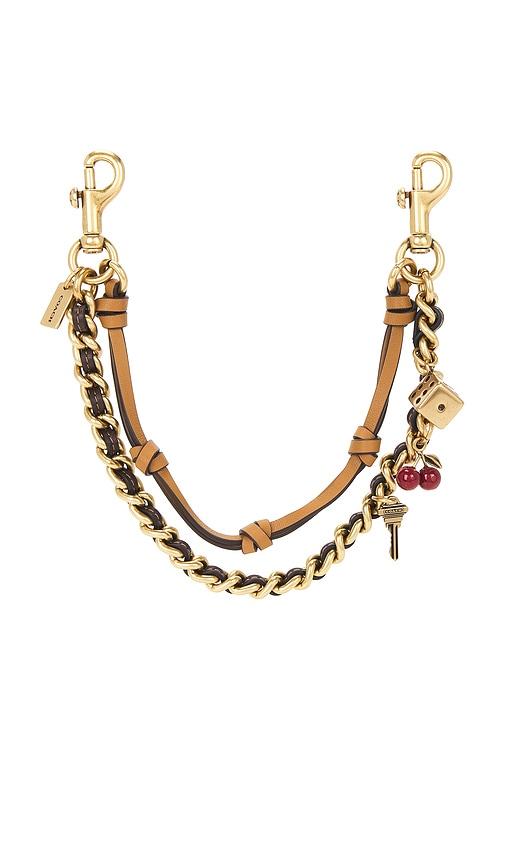 coach leather and metal swag bag charm in metallic gold.