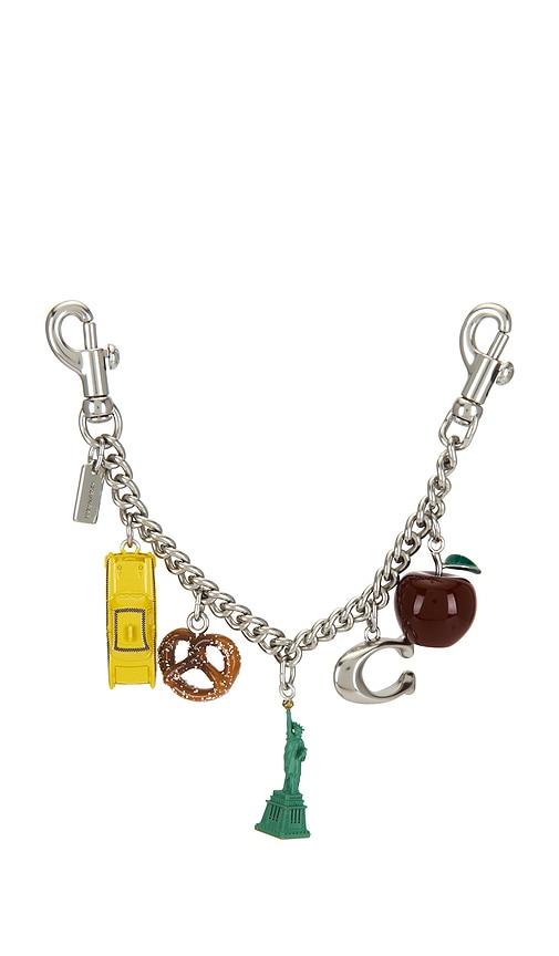 coach new york motif chain bag charm in metallic silver.