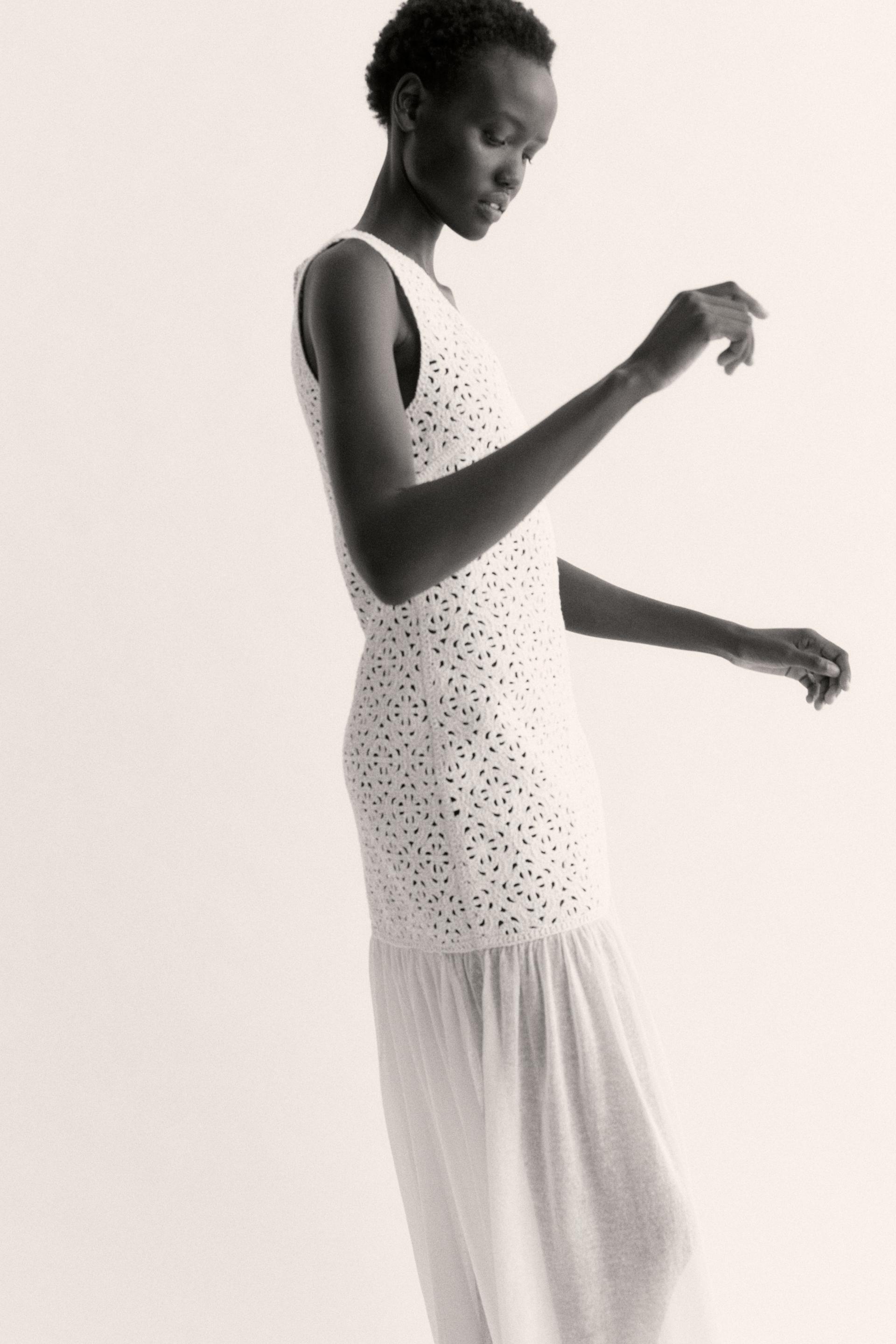 crochet-look dress with flared skirt