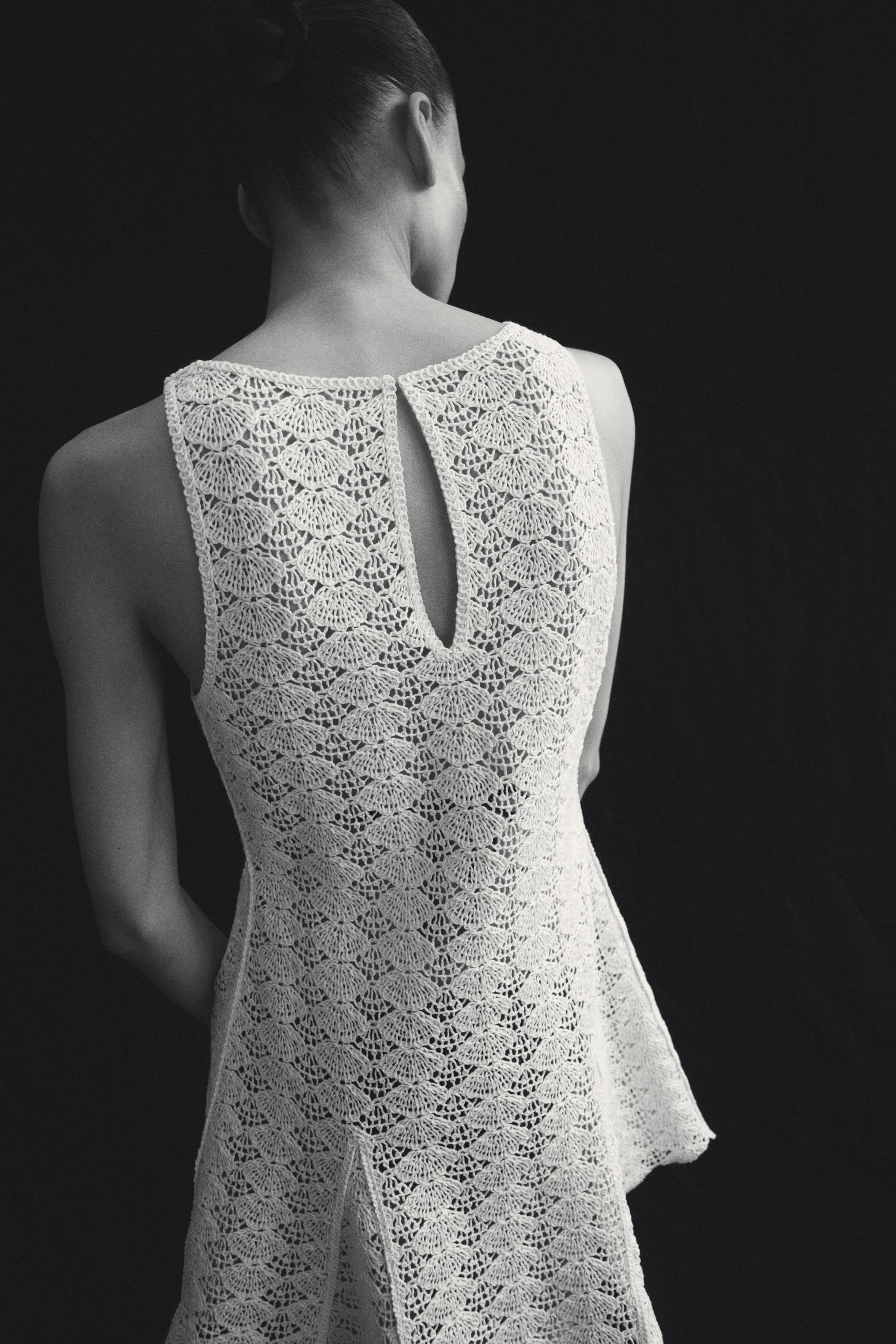 crochet-look dress with godet pleats