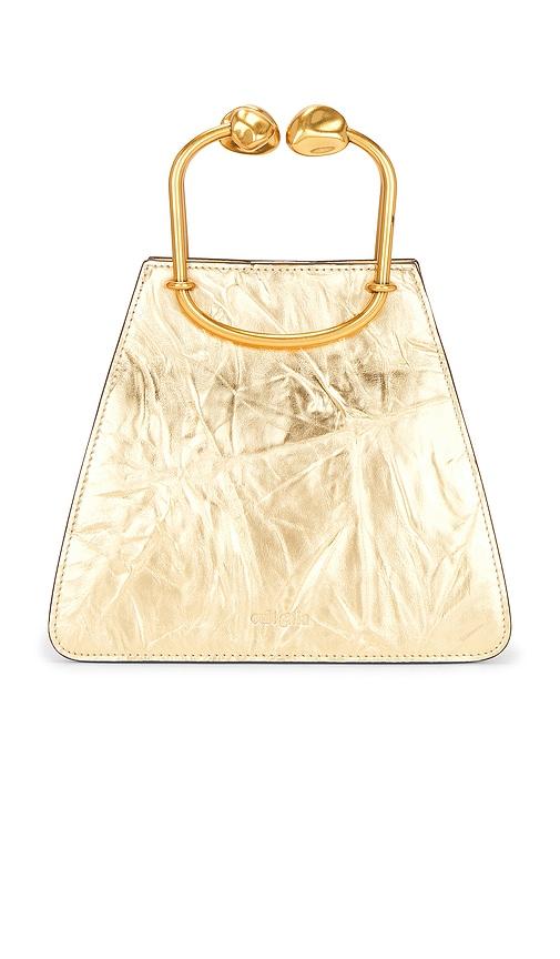 cult gaia maxine top handle bag in metallic gold.