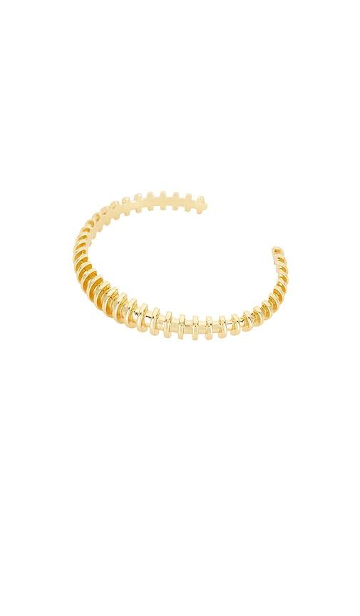 eddie borgo discus cuff bracelet in metallic gold.