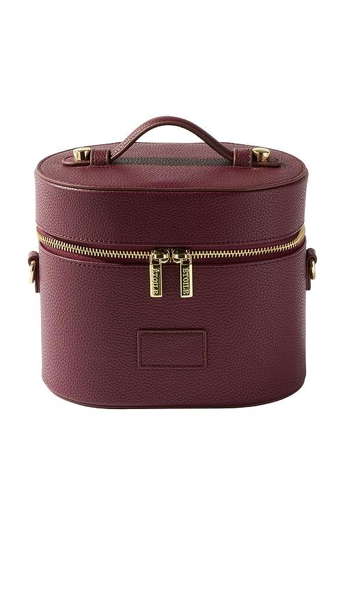 etoile collective oval toiletry case in burgundy.