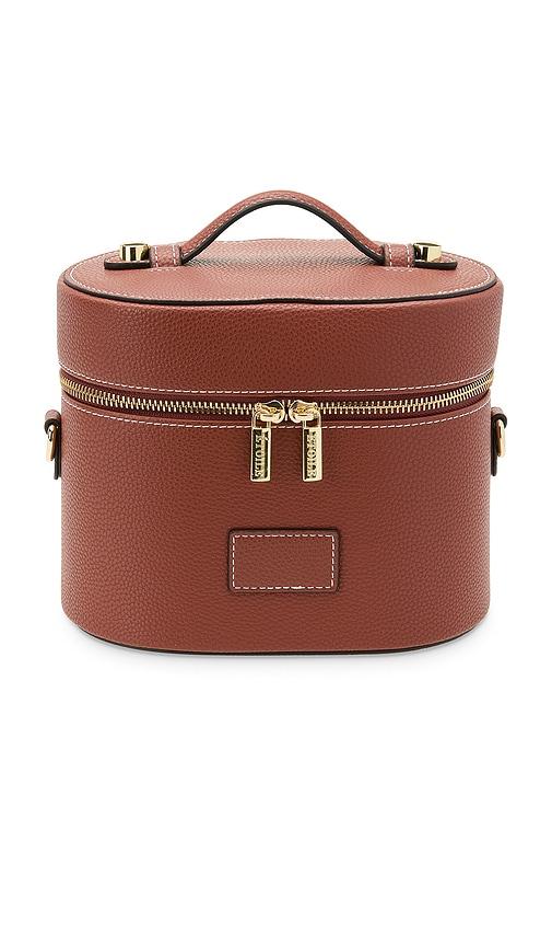 etoile collective oval toiletry case in ginger brown.