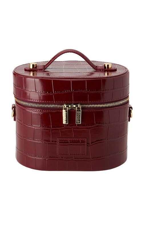 etoile collective x revolve oval toiletry case in burgundy croc.