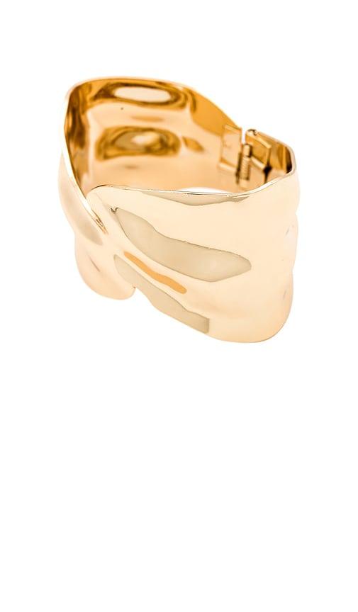 ettika abstract textured cuff bracelet in metallic gold.