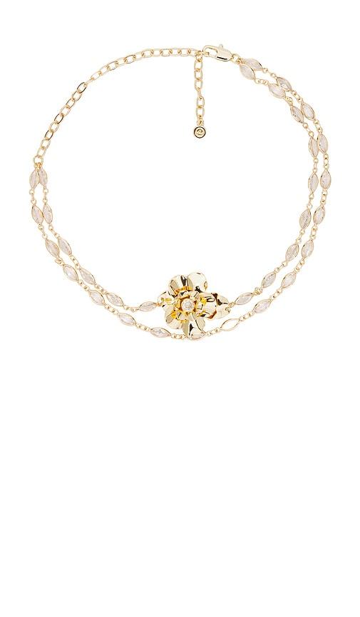 ettika bazel crystal layered flower necklace in metallic gold.