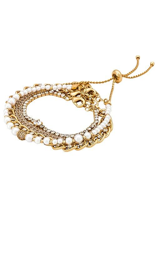 ettika chain bracelet set in metallic gold.