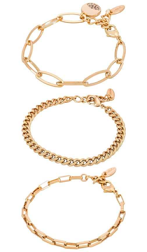 ettika chain bracelet set in metallic gold.