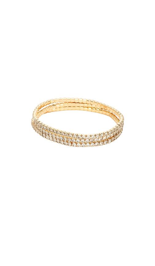 ettika crystal elastic bracelet set in metallic gold.