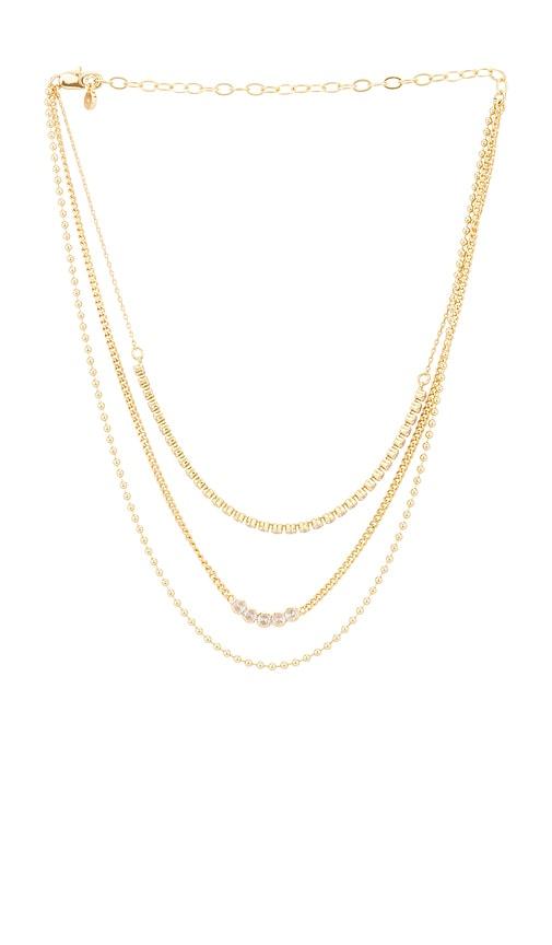 ettika crystal layers necklace in metallic gold.