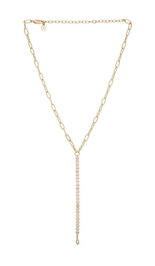 ettika crystal line pendant necklace in metallic gold.