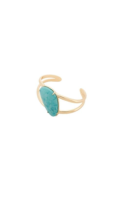 ettika desert tide cuff in metallic gold.