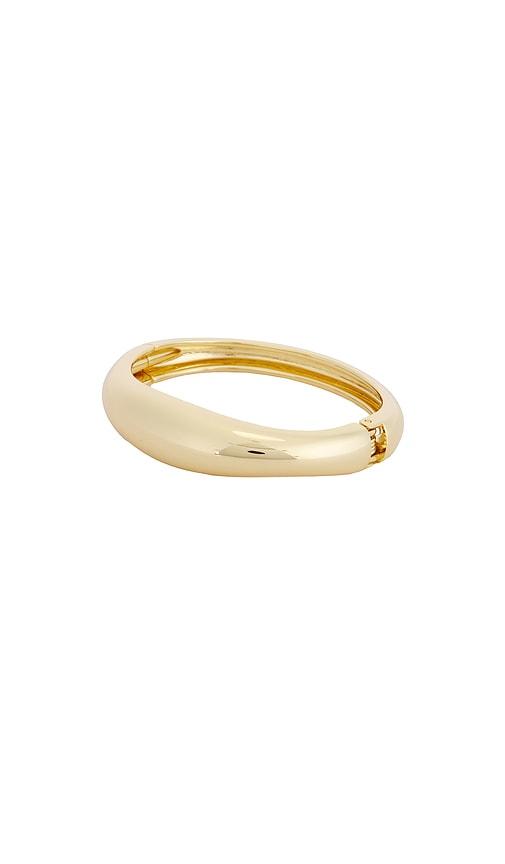 ettika dreamy dome bangle in metallic gold.
