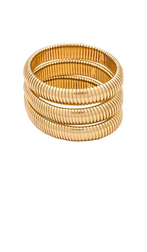 ettika flex snake chain stretch bracelet set in metallic gold.
