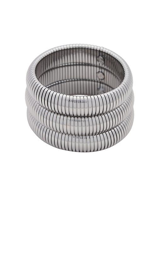 ettika flex snake chain stretch bracelet set in metallic silver.