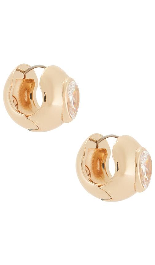 ettika glowing gem earrings in metallic gold.