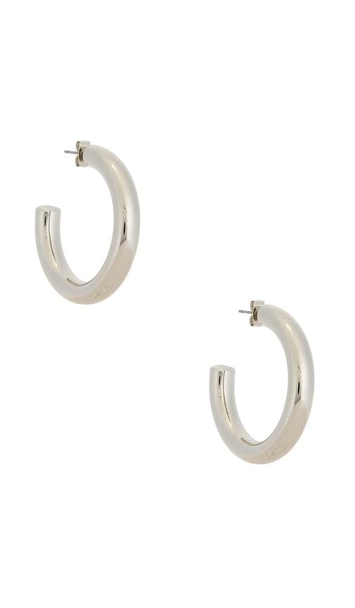 ettika medium thick classic hoops in metallic silver.