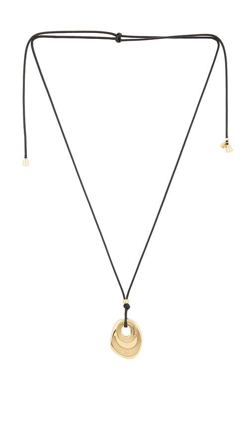 ettika melted edge pendant necklace in metallic gold.