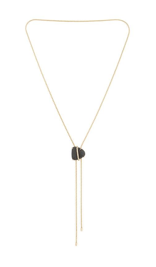 ettika midnight solstice bolo necklace in metallic gold.