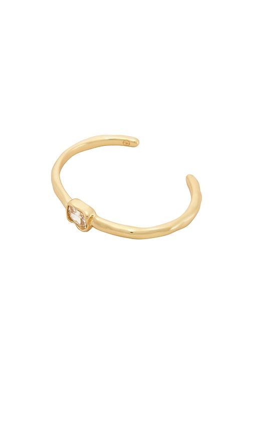 ettika molten crystal cuff in metallic gold.