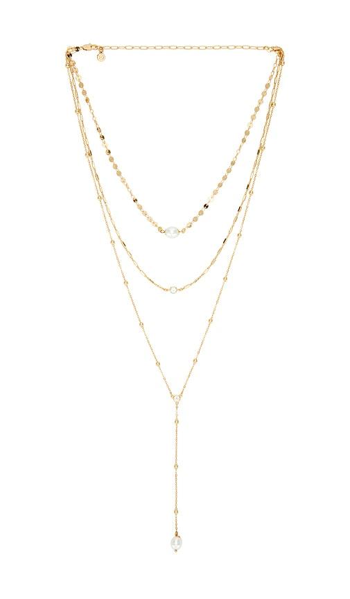 ettika multi-chain pearl lariat necklace in metallic gold.