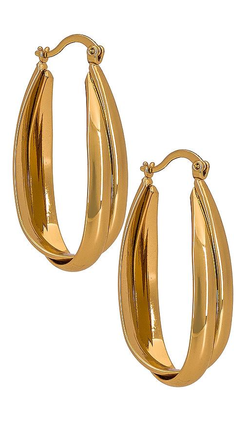 ettika oval hoop earring in metallic gold.